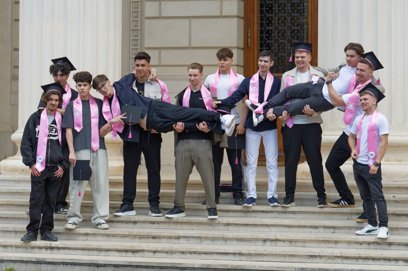 Group of young men celebrating their graduation